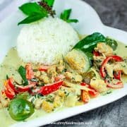 Thai green curry chicken with rice on a plate