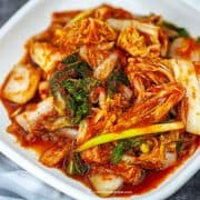 Kimchi on a white square plate