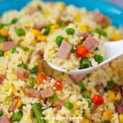 Chinese authentic ham fried rice on a white spoon