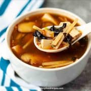 Authentic Chinese hot and sour soup on the spoon