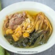 dried bok choy pork scallops soup in the white bowl
