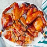 Chinese roast duck cut up on the white plate top view