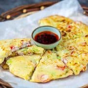 Chinese pancake cut up stack over with chili oil sauce