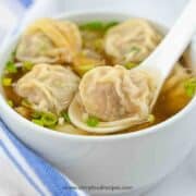 wonton soup with the wonton on a spoon