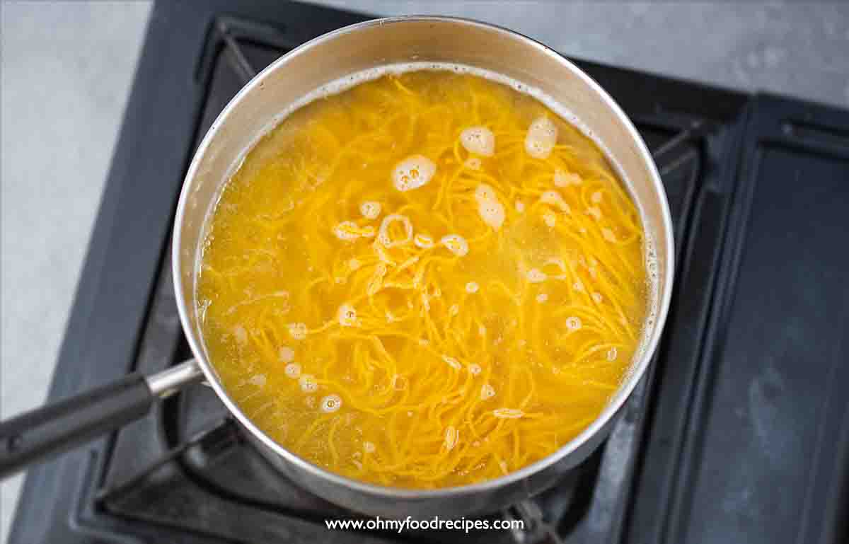 Cantonese egg noodles boil in the pot top view