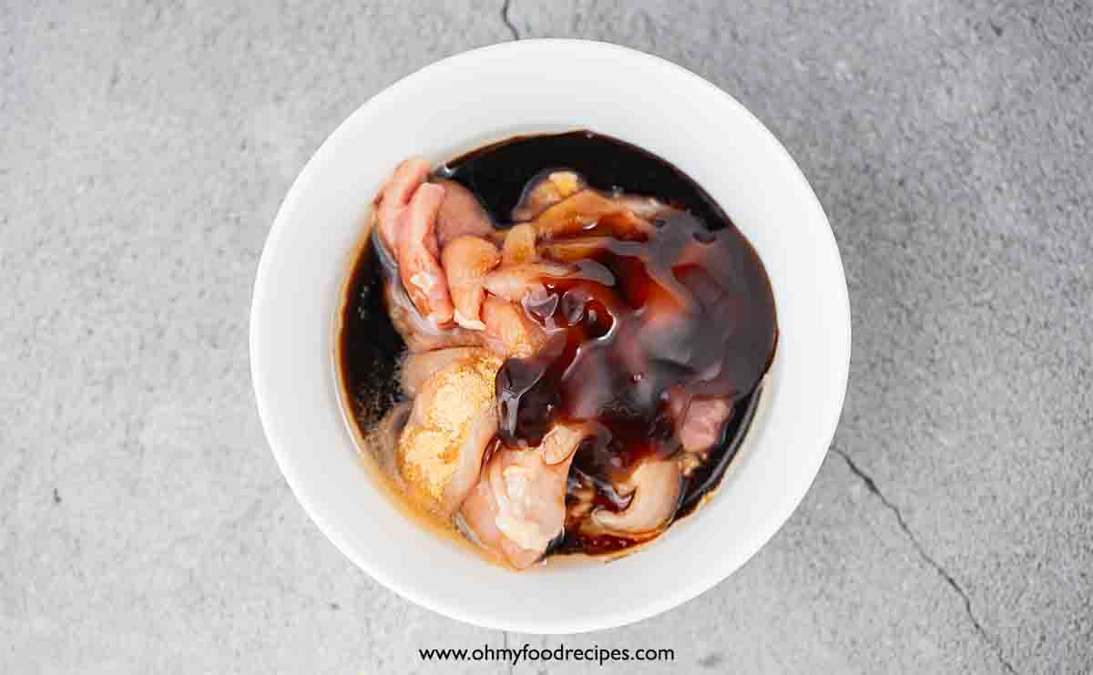 chicken and seasoning in the bowl top view