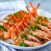 steamed garlic shrimp with vermicelli noodles on a plate with a towel