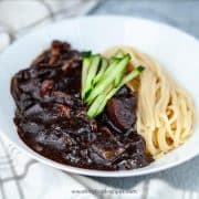 Korean black bean noodles top with cucumber stirps