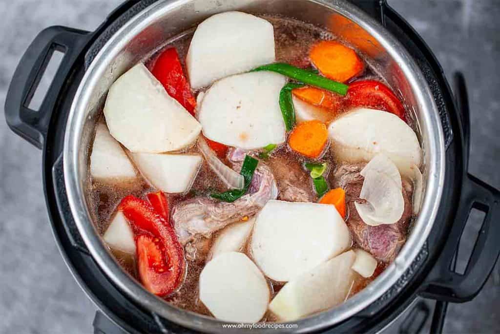 uncooked Taiwanese beef noodle soup in the pressure cooker