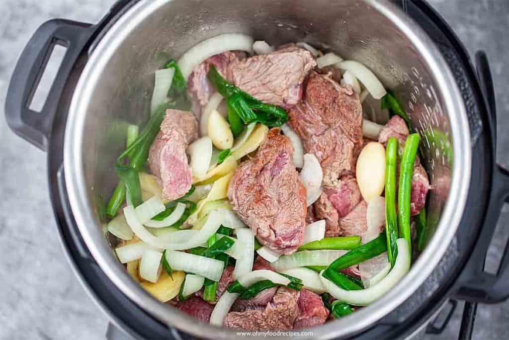 browning the meat both sides in the pressure cooker for Taiwanese beef noodle soup