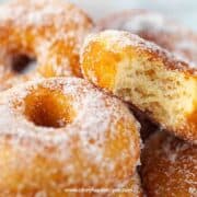 homemade sugar donuts with a bite one the donut