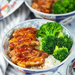 Japanese chicken teriyaki rice with broccoli in the bowls