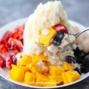 Chinese baobing Asian shaved ice with fruit on the spoon