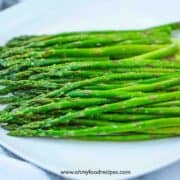 sitr fry asparagus on a white plate horizontal