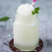 lychee slush in a cup with a pink & white straw