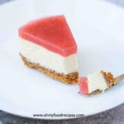 a slice of guava cheesecake with a fork