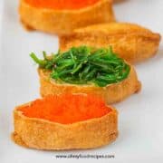 regular Inari sushi with fish roe and seaweed salad topping on the plate