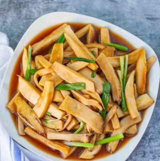 king oyster mushroom stir fry on the white plate top view