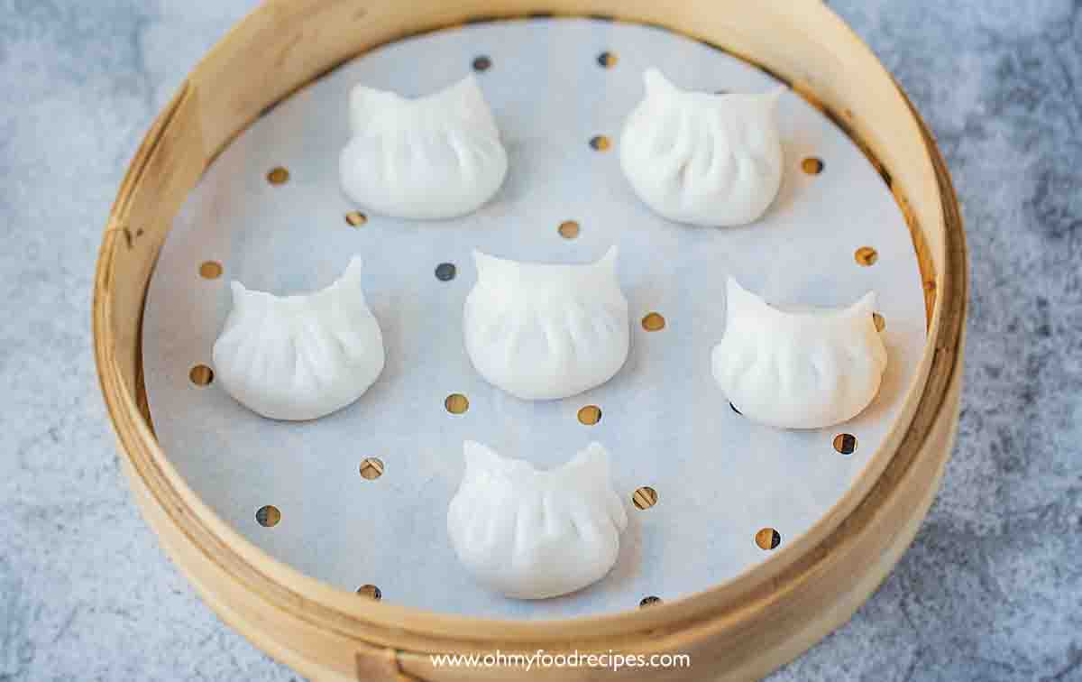 har gow or har gau shrimp dumplings in the bamboo steamer with a liner