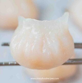 har gow or har gau shrimp dumpling on the silver chopsticks