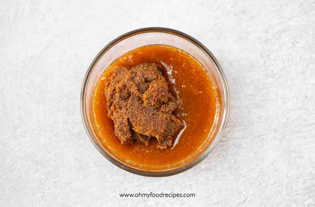 doenjang Korean soybean paste add into the raw honey in the glass container top view